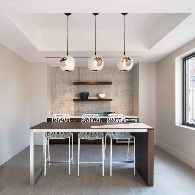 Instrata Pentagon City - Modern Dining Room with Pendant Lighting and a Large Window