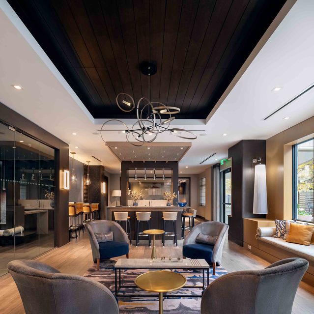 Instrata Pentagon City - Modern Lounge with Coffee Tables and Large Windows