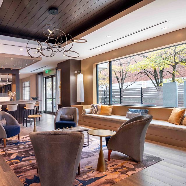 Instrata Pentagon City - Cozy Lounge Area with Coffee Tables and Large Windows