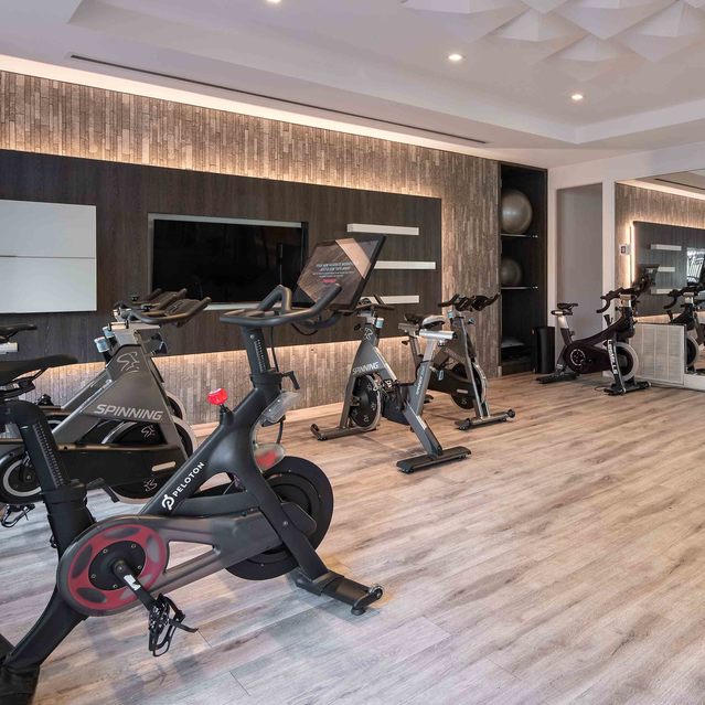 Instrata Pentagon City - Fitness Area with Mirrored Wall and Stationary Indoor Bikes