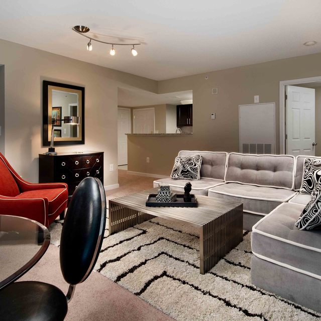 Instrata Pentagon City - Cozy Living Area with Accent Chair and L-shaped Sofa