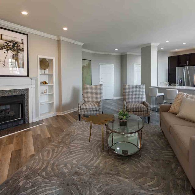 Instrata Pentagon City - Carpeted Living Area with Fireplace
