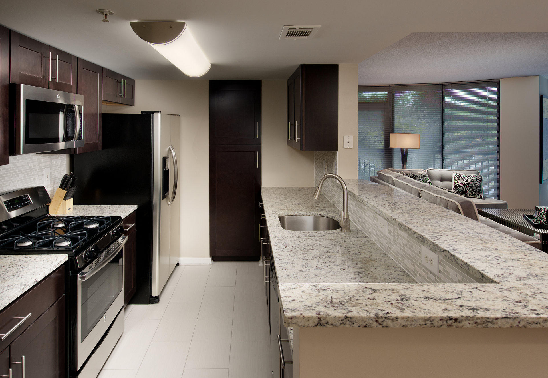 Stainless steel appliances and granite counter tops.